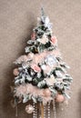 Christmas tree with pink and white patchwork ornament artificial flowers butterflies for new year
