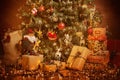 Christmas Tree and Present Gifts, Xmas Holiday Scene, Hanging Lighting and Toys Royalty Free Stock Photo