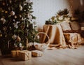 Christmas tree and presents in decorated living room