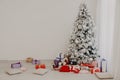 Christmas tree with presents, Garland lights Interior new year winter Royalty Free Stock Photo