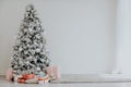 Christmas tree with presents, Garland lights Interior new year winter Royalty Free Stock Photo