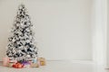 Christmas tree with presents, Garland lights Interior new year winter holiday background Royalty Free Stock Photo