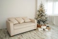 Christmas tree with presents underneath in living room Royalty Free Stock Photo