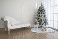 Christmas tree with presents underneath in living room Royalty Free Stock Photo
