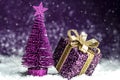 Christmas tree, purple gift with a gold bow