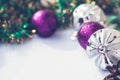 New year theme: Christmas tree purple and silver decorations, balls on white retro wood background