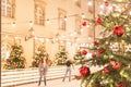 Christmas tree with red balls on the ice rink, blurred background Royalty Free Stock Photo