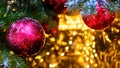 Christmas tree with red bauble and bokeh, copy space. Xmas decorations on new year Royalty Free Stock Photo