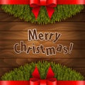 Christmas tree with red bow on the wood background