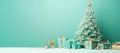 Christmas tree with gift boxes in the green or tiffany blue background with empty space.