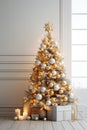 christmas tree with red and gold colored balls on white room wall Royalty Free Stock Photo