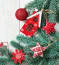 Christmas tree red toys background. Pine branches on white wooden background. Flat lay. Copy space. Happy New Year greeting card. Royalty Free Stock Photo