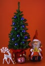 Christmas tree with reindeer  santa claus and ornament on red background Royalty Free Stock Photo