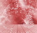 Christmas tree, reindeer and snow on red background. Red empty wooden table ready for your product display montage. Happy holidays Royalty Free Stock Photo