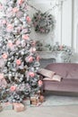 The Christmas tree in the room near the fireplace, the Christmas mood with gifts Royalty Free Stock Photo