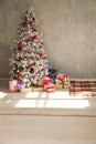 Christmas tree in a room with toys and gifts holiday new year winter postcard Royalty Free Stock Photo