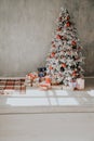 Christmas tree in a room with toys and gifts holiday new year winter postcard Royalty Free Stock Photo