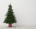 Christmas tree in room with vintage wooden floor and white wall, background