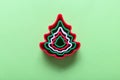 Christmas tree shape gingerbread cookie cutters on green background, top view Royalty Free Stock Photo