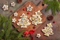 Christmas tree shape gingerbread cookies covered with white and dark chocolate, decorated with chopped pistachio nuts Royalty Free Stock Photo