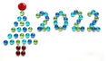 Christmas tree shape and numbers 2022 made of glass drops on white background Royalty Free Stock Photo