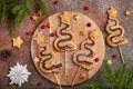 Christmas tree shape puff pastry cakes with chocolate filling and sugar powder.