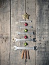 Christmas tree shape with wrenches on a old rustic wood Royalty Free Stock Photo