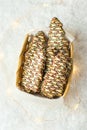 Christmas tree shaped shortbread cookies decorated with chocolate icing multicolored sugar sprinkles in wicker basket. Winter snow