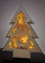 Christmas tree-shaped wooden decoration iluminated Royalty Free Stock Photo