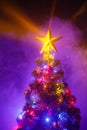 Christmas tree with shining star and frozen mist Royalty Free Stock Photo