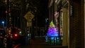 Christmas tree on sidewalk at South Avenue  before Christmas with holidays lights and decor Royalty Free Stock Photo