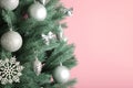 Christmas tree with silver balls on pink background. Christmas card with white silver decor Royalty Free Stock Photo