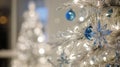 Christmas tree with silver and blue ornaments, blurred winter carnival Royalty Free Stock Photo