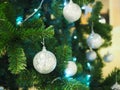 A Christmas tree with silver ornaments is a festive sight. Selective focus. Royalty Free Stock Photo