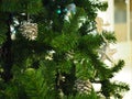 A Christmas tree with silver ornaments is a festive sight. Selective focus. Royalty Free Stock Photo