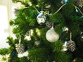 A Christmas tree with silver ornaments is a festive sight. Royalty Free Stock Photo