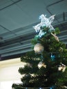 A Christmas tree with silver ornaments and silver star is a festive sight. Selective focus. Royalty Free Stock Photo