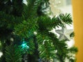 A Christmas tree with silver star ornaments is a festive sight. Selective focus. Royalty Free Stock Photo