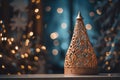 a christmas tree sits on a table in front of a christmas tree