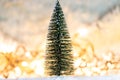 Christmas tree on snow with gift and light bokeh backgrounds ,Snowy Christmas or New Year festive background Royalty Free Stock Photo