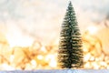 Christmas tree on snow with gift and light bokeh backgrounds ,Snowy Christmas or New Year festive background Royalty Free Stock Photo