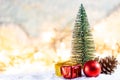 Christmas tree on snow with gift and light bokeh backgrounds ,Snowy Christmas or New Year festive background Royalty Free Stock Photo