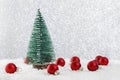 Christmas tree among snow and red balls Royalty Free Stock Photo