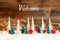 Christmas Tree, Snow, Red Star, Text Welcome, Wooden Background Royalty Free Stock Photo