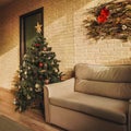 Christmas tree and sofa home, decoration. Royalty Free Stock Photo