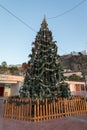 Christmas tree standing at Playa de Amadores beach on Gran Canaria island in Spain. Royalty Free Stock Photo