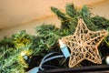 Christmas tree star decorations New Year baubles on decorated with blurred background