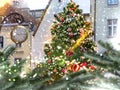 Christmas tree on street , decoration in city,pine tree branch , holiday end ,snowy festive blurred guirlande light in Tallinn old Royalty Free Stock Photo