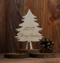 Christmas tree on a stub on a wooden background