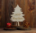 Christmas tree on a stub on a wooden background